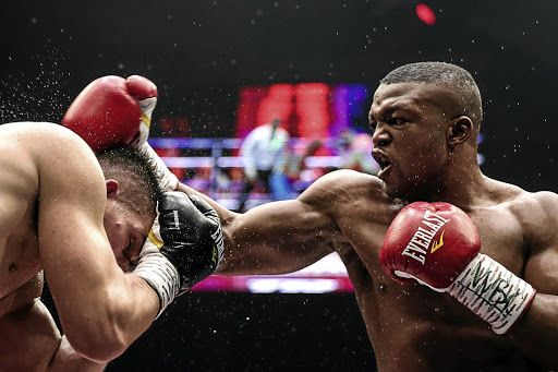 Russian boxer Alexei Papin, left, and SA-based Congolese fighter Ilunga Makabu in a title fight last weekend.