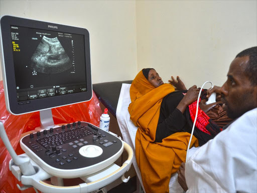 A Community Life Center nurse is doing a pregnancy scan on a Mandera woman with Philips ultrasound technology.Photo Courtesy