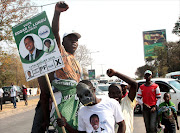 Zambia's ruling party Patriotic Front president-elect Edgar Lungu's supporters celebrate after the announcement of Lungu as the Presidential race winner in Lusaka. AFP PHOTO