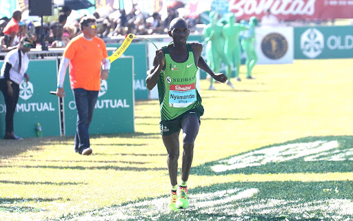 Hatiwande Nyamande nearing the finishing line at the third in the 2017 Comrades Marathon on June 04, 2017 in Durban, South Africa.