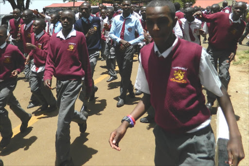 Happy Kapsabet Boys students yesterday after the release of KCSE in the streeets of Kapsabt town. PHOTO BY BARRY SALIL.