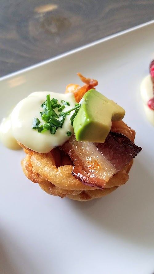 smoky bacon benedict funnel cake with truffle hollandaise, avocado and chives donut from my first look at Outer Darkness Donuts, which on offer here only on Sundays are dark roast drip coffees, fun mimosas, loose leaf tea, and only one food dish you can order: a flight of mini-donuts.