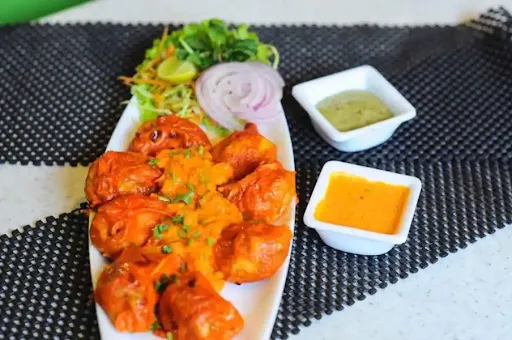 Veg Pan Fried Momos In Tandoori Sauce