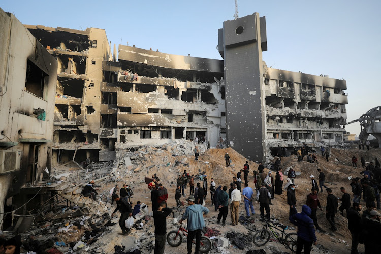 Palestinians inspect the damage at al-Shifa Hospital in Gaza City. Picture: REUTERS/DAWOUD ABU ALKAS