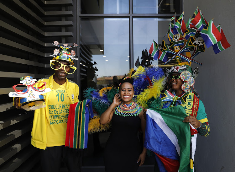 South African football super fans (left to right) Saddam Maake, Mammello Makha and Dan “Bishop” Motona visit the Tiso Blackstar Group offices in Partown, Johannesbug this week.