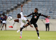 Vusimuzi Mncube of Sekhukhune United challenged by Bandile Shandu of Orlando Pirates during the DStv Premiership match between Orlando Pirates and Sekhukhune United at Orlando Stadium on November 02, 2021 in Johannesburg, South Africa. 