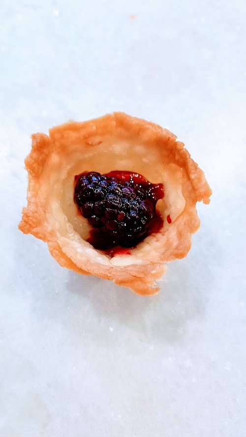 Berry Brie Bites, an easy recipe using only 4 ingredients, pie dough, brie, berry jam, and berry of your choice. Perfect for a party or potluck.