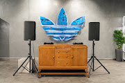 The Adidas trefoil logo has been reimagined out of taxi parts to create an artwork to hang in the DJ area of the Sandton City store.