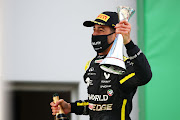 Third placed Daniel Ricciardo of Australia and Renault Sport F1 celebrates on the podium during the F1 Eifel Grand Prix at Nürburgring on October 11, 2020 in Nürburg, Germany.