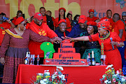 EFF leaders, led by Julius Malema, cut a cake to celebrate the party's birthday at Marikana on Wednesday.