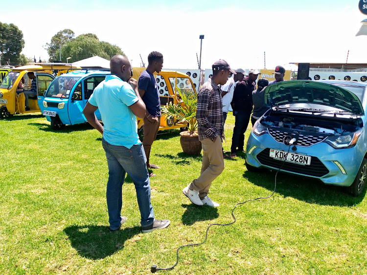 Members of the Public at Go Electric Ltd headquarters learn about electric and solar vehicle functionality during the public training and stakeholder engagement