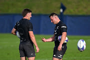 Jordie Barrett and Sam Cane of the All Blacks talk during a training session at LOU rugby club in Lyon, France on Wednesday. 