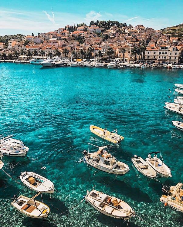 Free White Boats on Body of Water Stock Photo