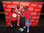 Logie Moorgas of Eden Foods holds aloft the trophy she won at the 'Best Bunny Chow in Jozi' competition at Gold Reef City's recent Curry & Craft Festival.
