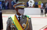 Colonel Assimi Goita, leader of two military coups and new interim president, walks during his inauguration ceremony in Bamako, Mali June 7, 2021. 
