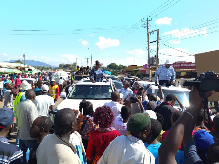 CCU leader and Machakos governor aspirant Nzioka Waita with his running mate and Machakos Speaker Florence Mwangangi during a political rally at Mtituni shopping centre in Machakos on March 18.