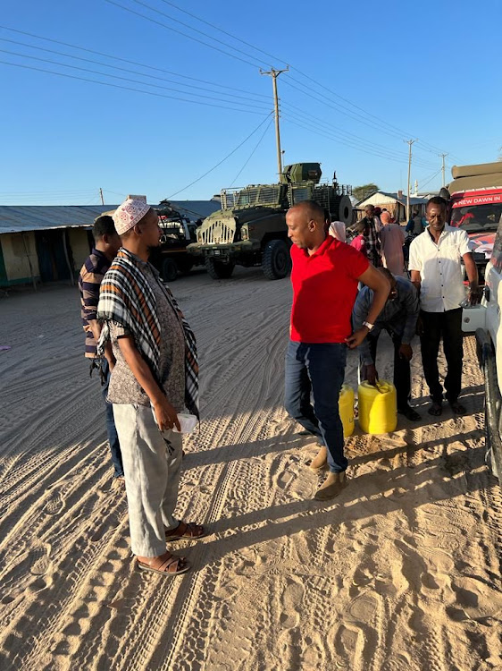 Isiolo Jubilee Gubernatoprial candidate Abdi Hassan Guyo lwith local elders during the rescue mission at Merti, Isiolo on June 10, 2022