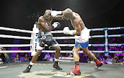 SA junior-middleweight champion Nkululeko Mhlongo jolts the head of Walter Dlamini en route to a fourth-round stoppage to win both the SA and WBA Pan African middleweight belts in the Sun Arena in Pretoria on Sunday. 