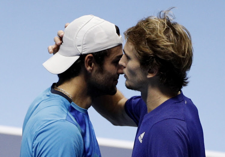 Italy's Matteo Berrettini, left, retires from his group stage match against Germany's Alexander Zverev after sustaining an injury in the ATP Tour Finals in Turin on November 14, 2021