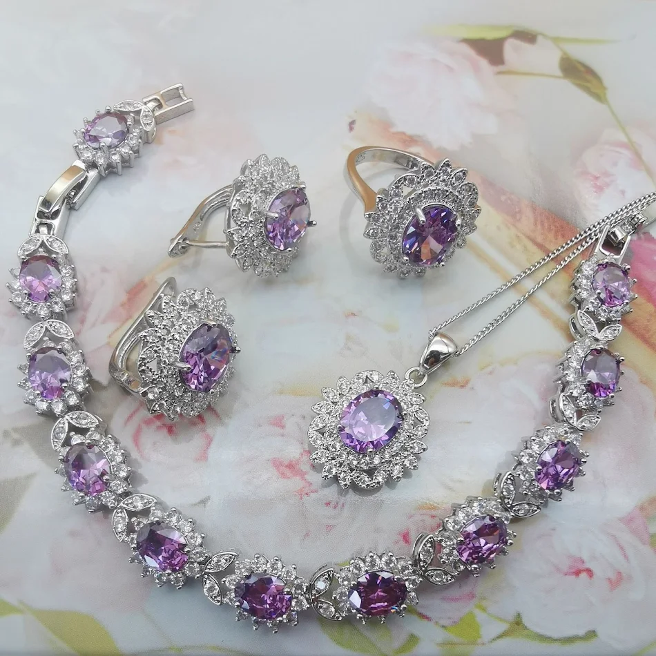Ensemble de bijoux quatre pièces grenat rouge, tempérament luxueux. L'accessoire idéal pour une élégance raffinée et un style sophistiqué.