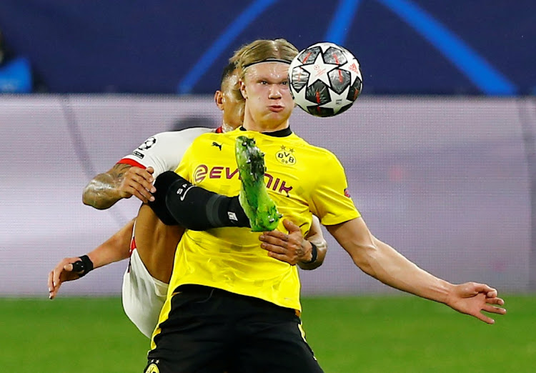 Borussia Dortmund's Erling Braut Haaland shields the ball in the Champions League, last 16 first leg against Sevilla at Ramon Sanchez Pizjuan, Seville on February 17, 2021