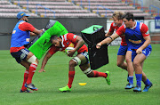 Nizaam Carr gets tackled during the DHL Stormers training session and press conference at Newlands Stadium on April 13, 2017 in Cape Town, South Africa.