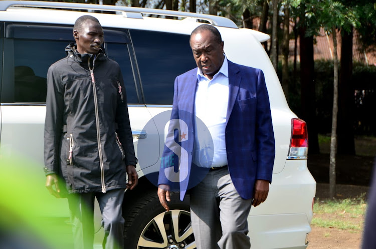 Raymond Moi casting arrives at Mercy Njeri primary school in Rongai area to cast vote