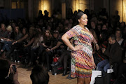 A plus-size model on the catwalk during the fashion show at the Official British Plus-Size Fashion Weekend at Shoreditch Town Hall, East London on February 16, 2013.