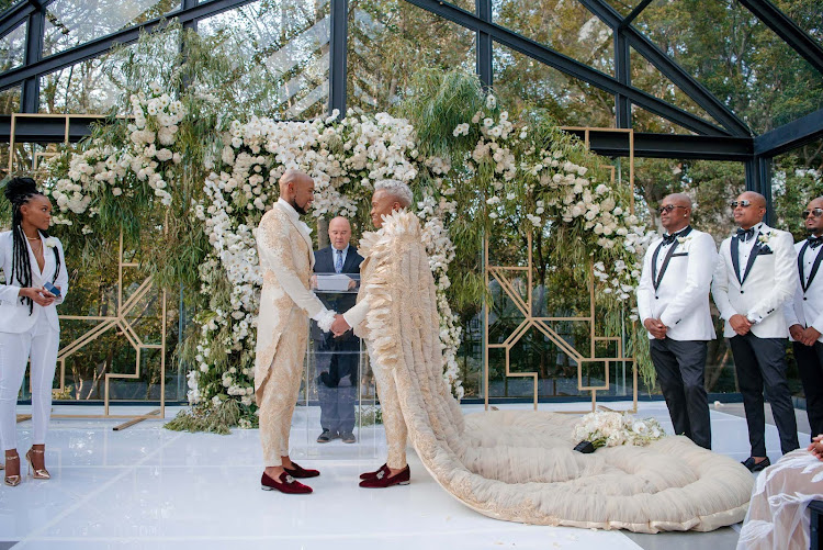 The grooms looked regal in coordinating suits by designer to the stars, Gert-Johan Coetzee.