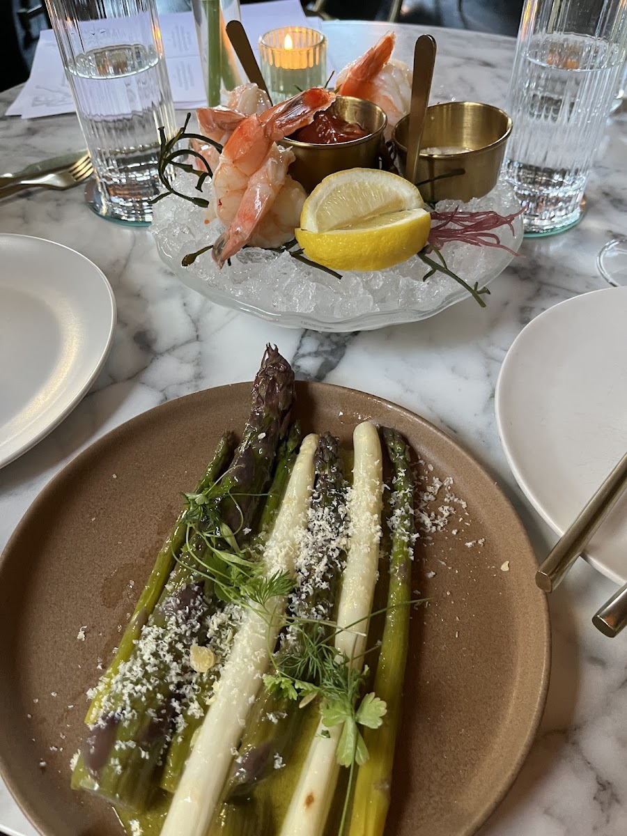 Shrimp cocktail and asparagus with ramp dressing.