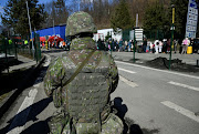 An officer stands guard at the border crossing, after Russia launched a massive military operation against Ukraine, in Ubla, Slovakia, February 27, 2022. 