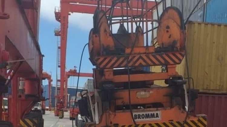 The aftermath of the March 2021 incident in which a container gantry fell on a truck driver's cab, crushing him to death.