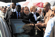 President Jacob Zuma leaves Lonmin's Marikana informal settlement after addressing thousands of angry workers, almost a week after 34 of their striking colleagues were shot dead by police Picture: MOELETSI MABE