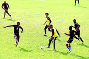 HAVING A BALL: Pirates players Lehlohonolo Majoro, Issa Sarr and Edwin Gyimah at  yesterday's session at Rand Stadium 
      
      
      
      Photo:   Lefty Shivambu/Gallo Images