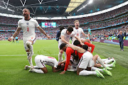 England players celebrate after Raheem Sterling scored the opening goal at Wembley. 