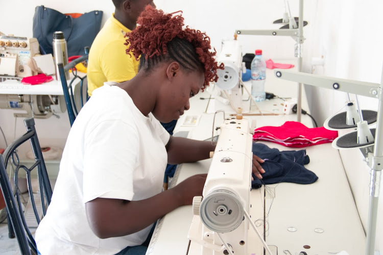 Sewing of reusable sanitary towels STADA in Kisumu's Alendu area.