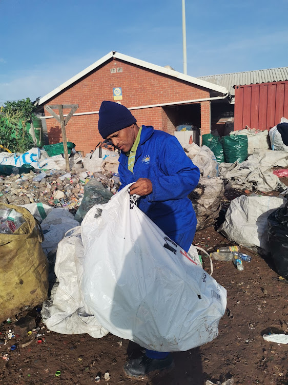 Frank Goliath separates waste at THE Missionvale Care Centre’s recycling unit