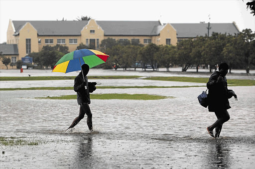 Employees of the River Club, in Observatory, Cape Town, resorted to removing their shoes and trousers when the place flooded and they had to get out