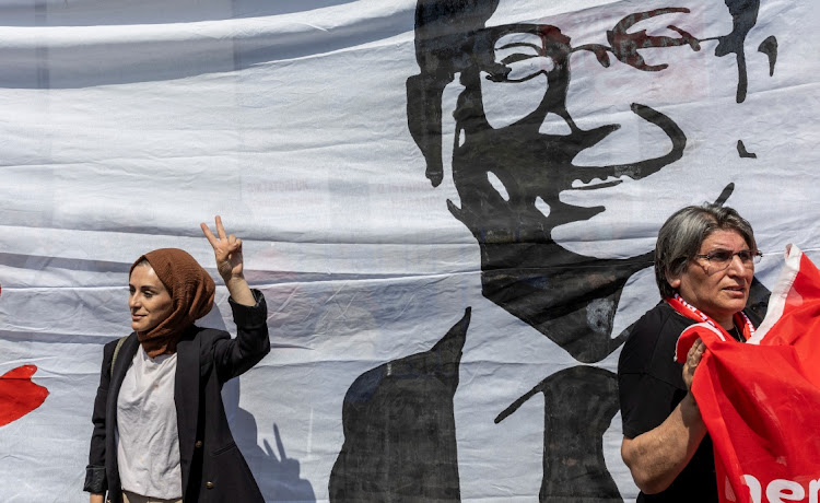 Supporters of Istanbul Mayor, Ekrem Imamoglu, demonstrate in front of a court house as a Turkish court is expected to reach a verdict in the trial of Imamoglu, who is accused of insulting state officials with comments he made at the time of elections in 2019, with prosecutors seeking the imposition of a political ban on him, in Istanbul, Turkey, June 1, 2022.