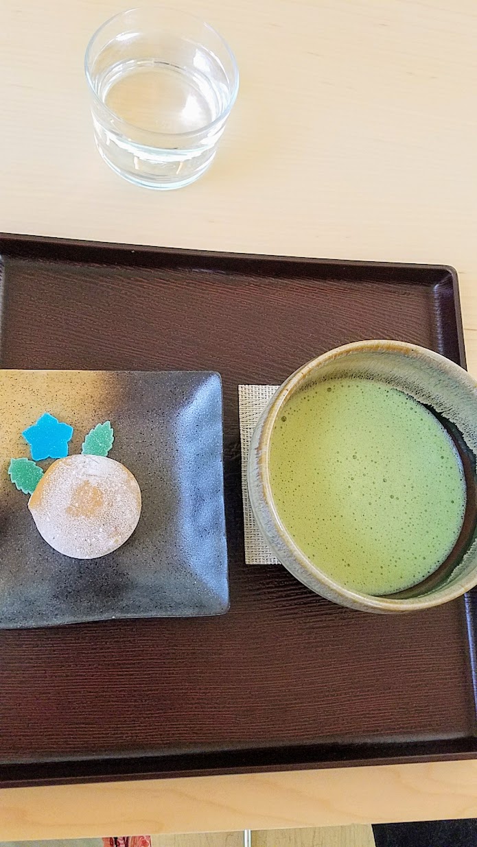 Visiting the Portland Japanese Garden Umami Cafe offering Japanese teas and snacks, Matcha with Mochi Ice Cream Set with a bowl of hand whisked matcha paired with premium chocolate ice cream wrapped in sweet rice dough