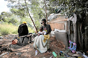 Florence Chauke and  her baby at home  near Edenvale Hospital, east of Johannesburg. The area has been occupied  by Alexandra residents