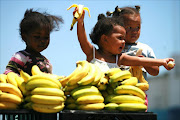 Children in East London enjoying a  banana or two. Picture: THEO JEPTHA.