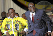 Zimbabwe's President Robert Mugabe with his former deputy, Emmerson Mnangagwa. File photo.