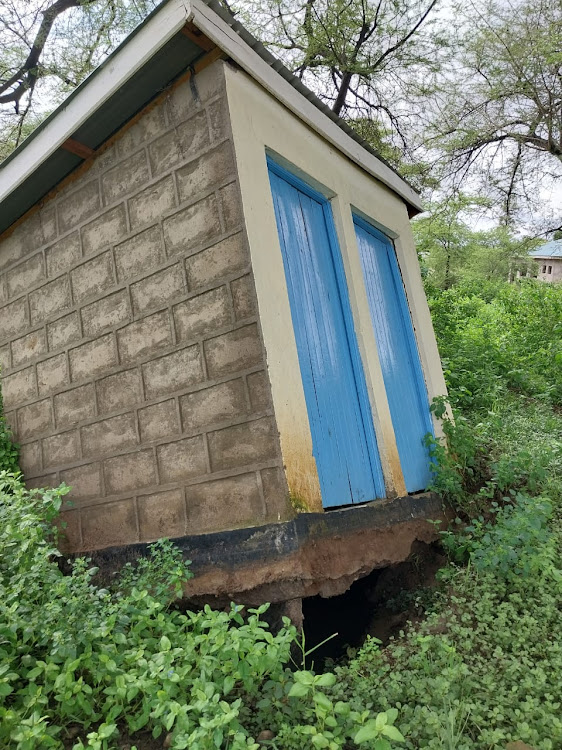 A toilet left hanging after floods destroyed several of them on April 29 in Kajiado West.