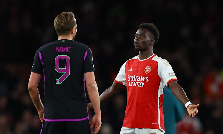 Bayern Munich's Harry Kane and Arsenal's Bukayo Saka after the Uefa Champions League quarterfinal first leg match at Emirates Stadium in London on Tuesday night.