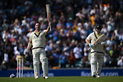 Travis Head of Australia celebrates after scoring a century as Steve Smith of applauds on day one of the ICC World Test Championship final against India at The Oval in London on June 7 2023.