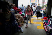 Ukrainians who recently arrived to Mexico fleeing the Russian invasion of their homeland wait for their turn to try to get into the U.S. near the San Ysidro Port of Entry of the US-Mexico border, in Tijuana, Mexico March 30, 2022. 