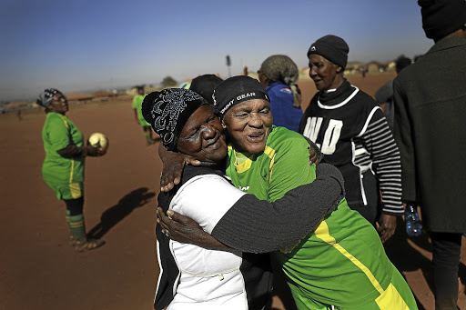 Players hug players after a game.