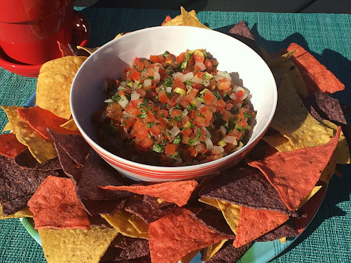 A delicious bowl of Pico de Gallo served with tortilla chips