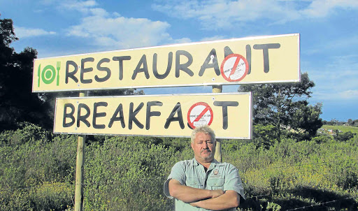 SIGN OF THE TIMES: Shabanga Guest Farm owner Pieter Swanepoel feels he has been singled out because signs on private land advertising his Cove Rock business have been issued with Sanral stickers instructing him to remove them Picture: SUPPLIED